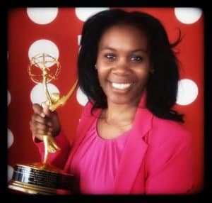 Producer Aiesha Francis holding an Emmy Award